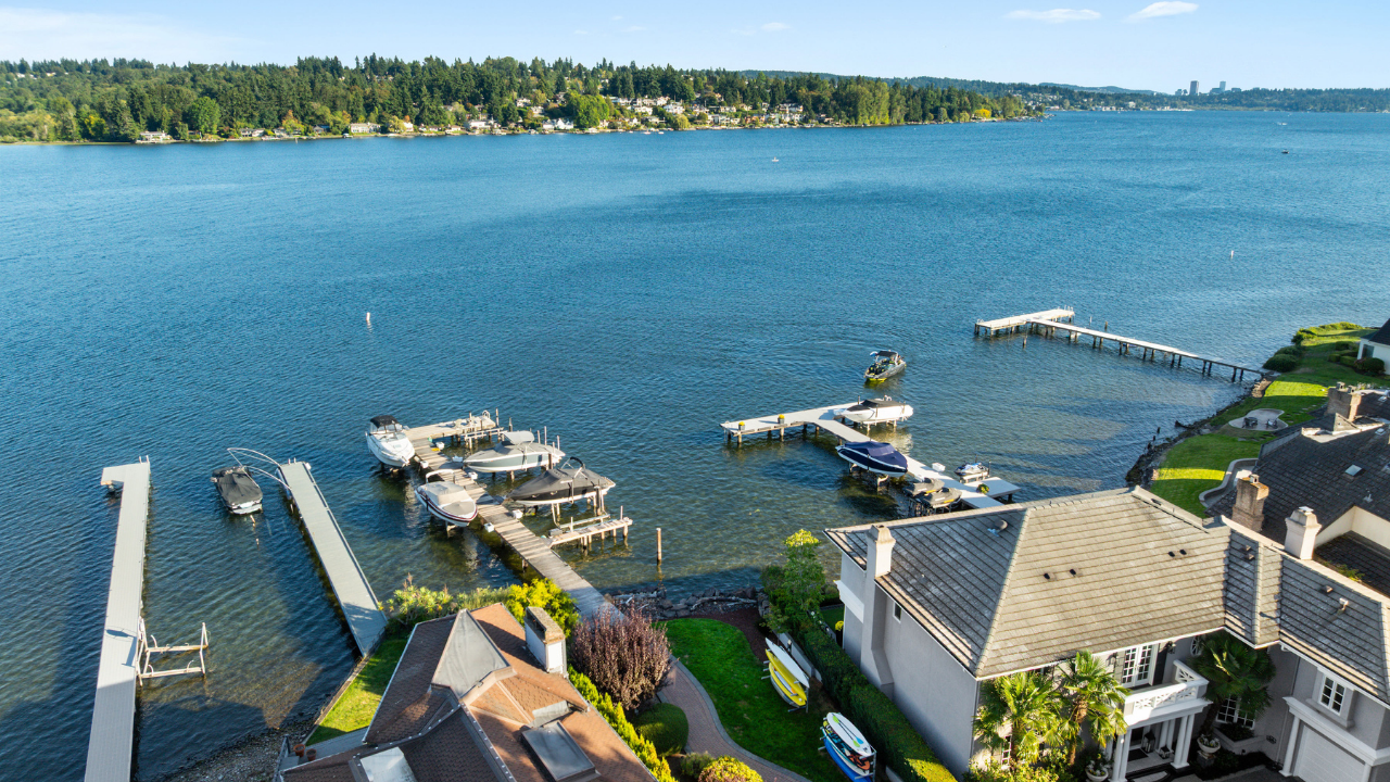 Aerial sunset view of Kirkland waterfront condos and marina on Lake Washington